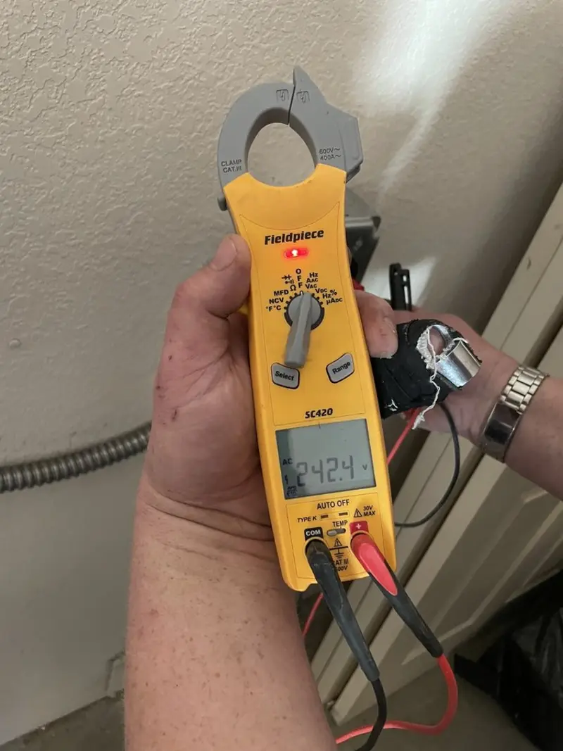 Voltage testing with clamp meter during Electrical Installation Services in Gainesville